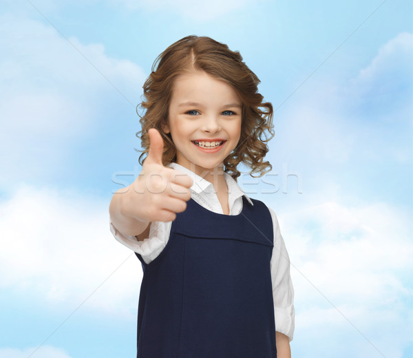 happy little school girl showing thumbs up Stock photo © dolgachov