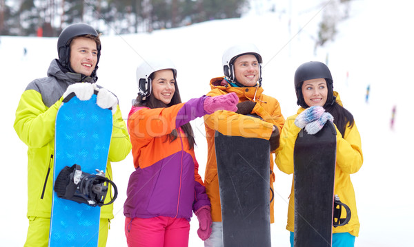 happy friends in helmets with snowboards Stock photo © dolgachov