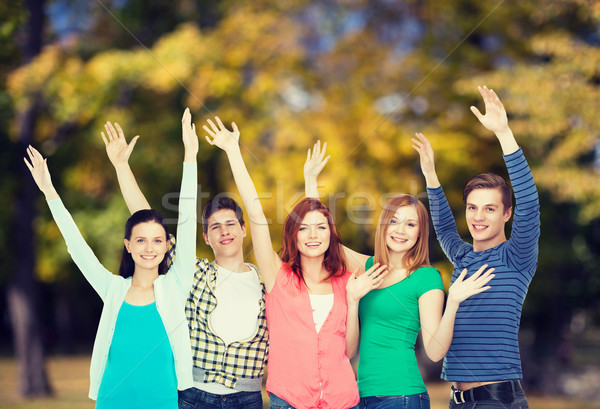Grupy uśmiechnięty studentów ręce edukacji Zdjęcia stock © dolgachov