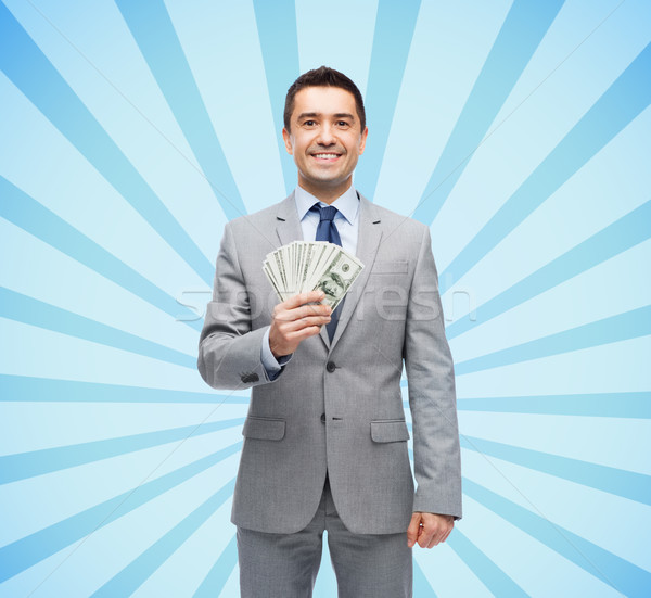 Stock photo: smiling businessman with american dollar money