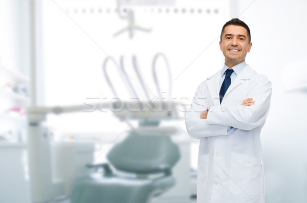 smiling male middle aged dentist Stock photo © dolgachov