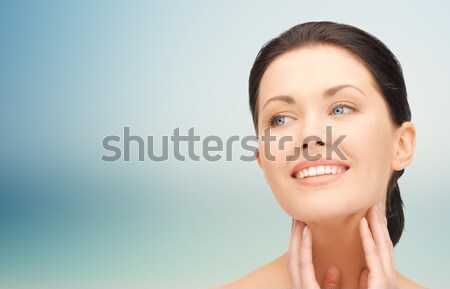 beautiful young woman touching her face and neck Stock photo © dolgachov