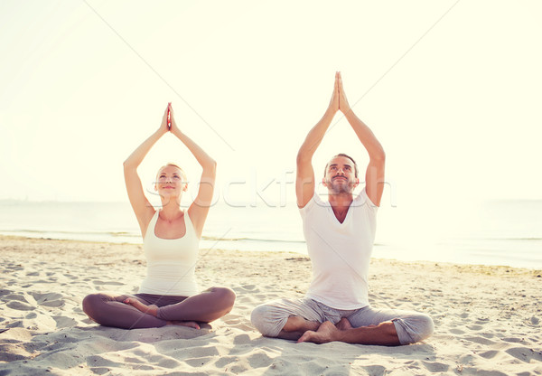 Gülen çift yoga açık havada uygunluk Stok fotoğraf © dolgachov