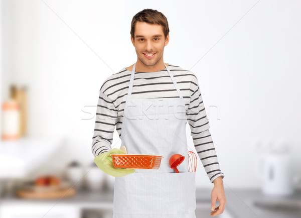 happy man or cook with baking and kitchenware Stock photo © dolgachov