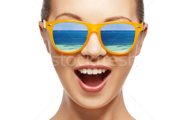 amazed girl in shades Stock photo © dolgachov