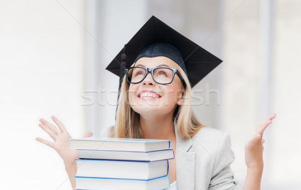 happy student in graduation cap Stock photo © dolgachov