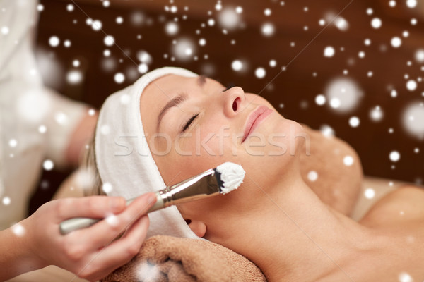 woman face and beautician applying mask in spa Stock photo © dolgachov