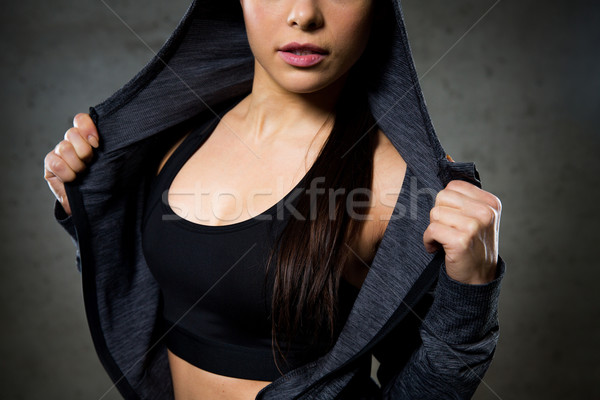 Közelkép nő pózol mutat sportruha sport Stock fotó © dolgachov