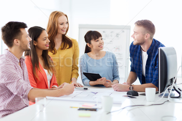 happy creative team or students working at office Stock photo © dolgachov