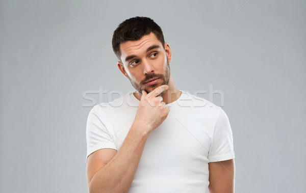 man thinking over gray background Stock photo © dolgachov