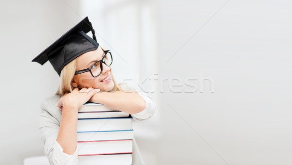 student in graduation cap Stock photo © dolgachov