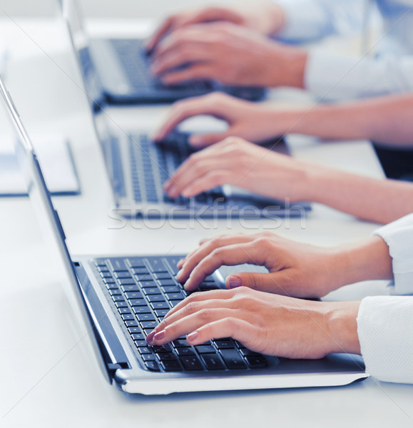 group of people working with laptops in office Stock photo © dolgachov