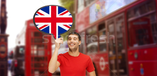 man with text bubble of british flag in london Stock photo © dolgachov