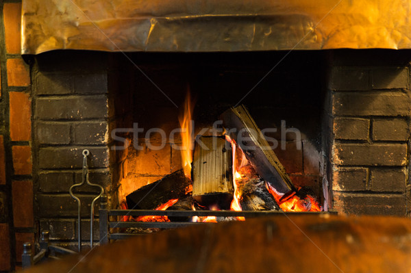 close up of burning fireplace at home Stock photo © dolgachov