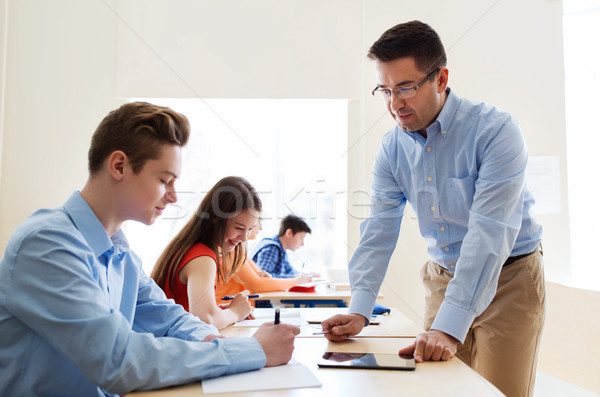 group of students and teacher at school classroom Stock photo © dolgachov
