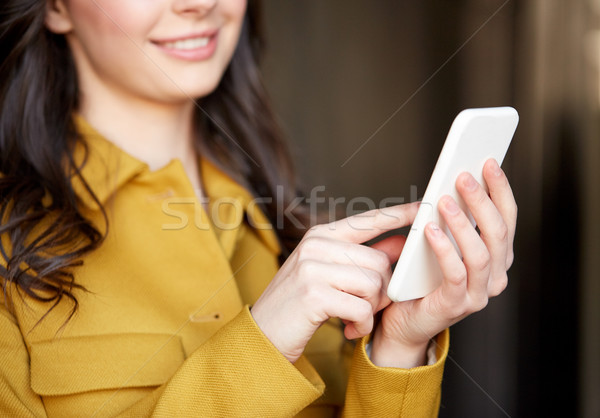 close up of young woman or girl with smartphone Stock photo © dolgachov