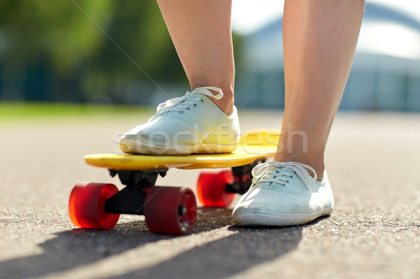 close up of female feet riding short skateboard Stock photo © dolgachov