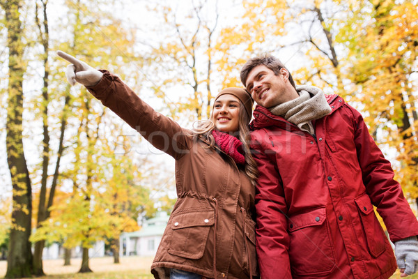 happy young couple walking in autumn park Stock photo © dolgachov