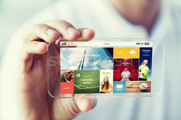 close up of male hand with news on smartphone Stock photo © dolgachov