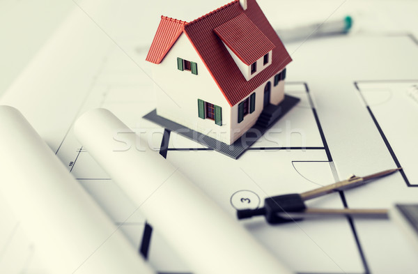 close up of house model on architectural blueprint Stock photo © dolgachov