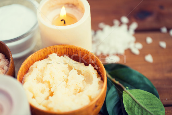 close up of natural body scrub and candle on wood Stock photo © dolgachov