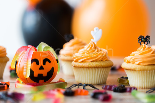 halloween party decorated cupcakes on wooden table Stock photo © dolgachov