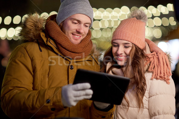happy couple with tablet pc at christmas market Stock photo © dolgachov