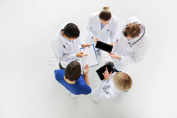 Stock photo: doctors with cardiogram and and tablet pc