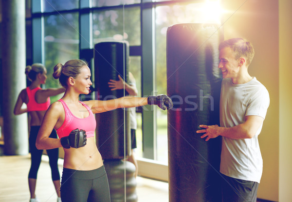 Donna sorridente personal trainer boxing palestra sport fitness Foto d'archivio © dolgachov