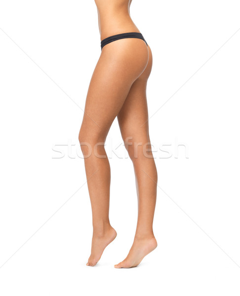 Femeie picioare negru bikini chilotei imagine Imagine de stoc © dolgachov