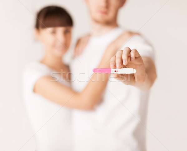 woman and man hands with pregnancy test Stock photo © dolgachov