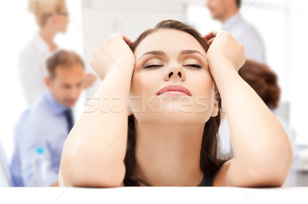 stressed businesswoman in office Stock photo © dolgachov