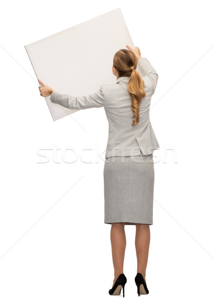 businesswoman or teacher in suit from back Stock photo © dolgachov