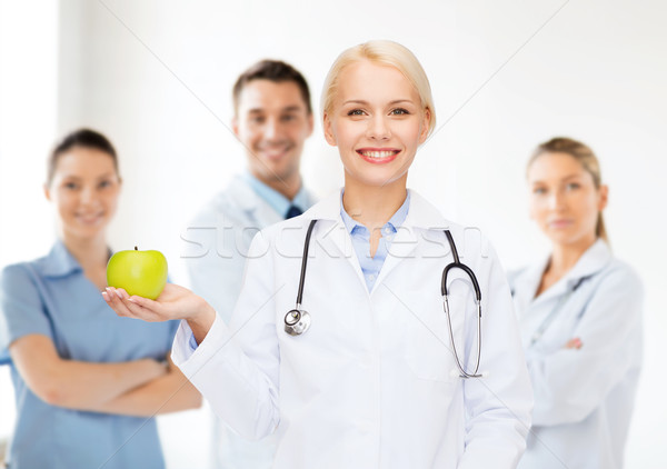 улыбаясь женщины врач зеленый яблоко здравоохранения Сток-фото © dolgachov
