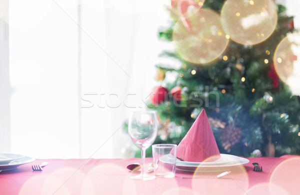 room with christmas tree and decorated table Stock photo © dolgachov