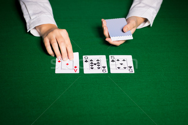 holdem dealer with playing cards Stock photo © dolgachov