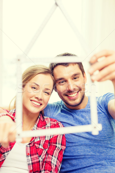 Sonriendo Pareja casa cinta métrica movimiento casa Foto stock © dolgachov