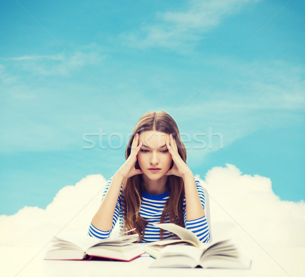 stressed student girl with books Stock photo © dolgachov