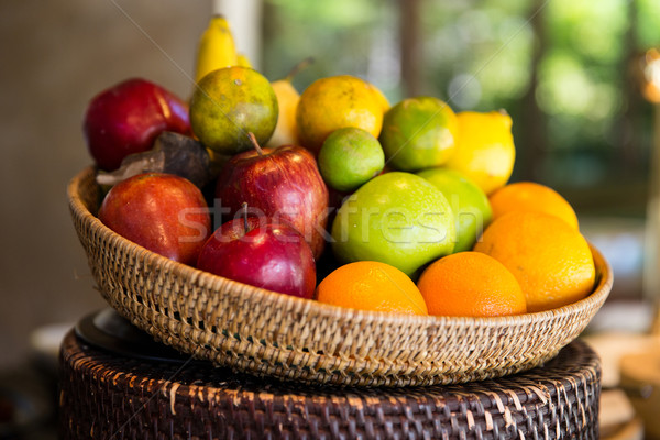 basket of fresh ripe juicy fruits at kitchen Stock photo © dolgachov