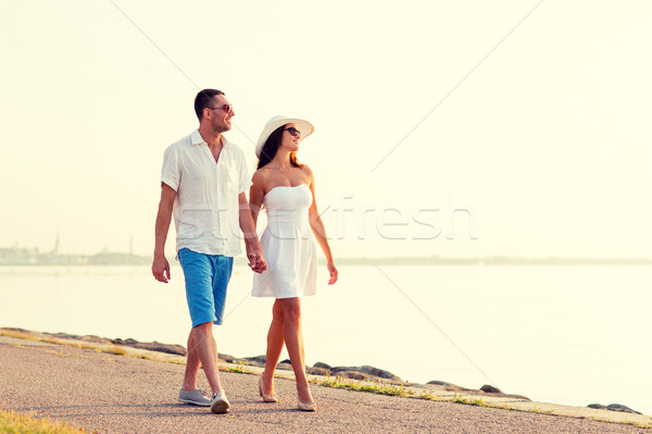 smiling couple walking outdoors Stock photo © dolgachov