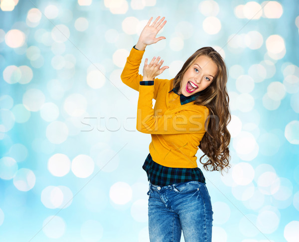happy young woman or teen girl applauding Stock photo © dolgachov