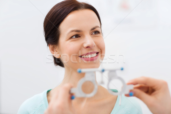 happy woman having vision test at eye clinic Stock photo © dolgachov