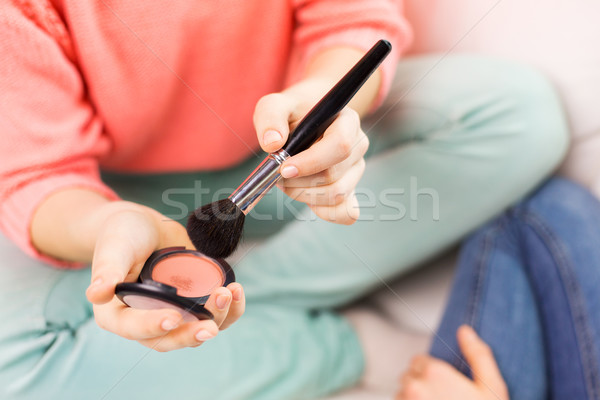 close up of woman with makeup brush and blush Stock photo © dolgachov