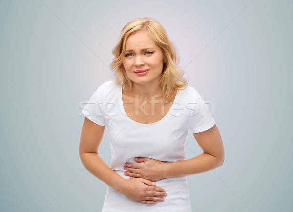 Nieszczęśliwy kobieta cierpienie ból brzucha ludzi opieki zdrowotnej Zdjęcia stock © dolgachov