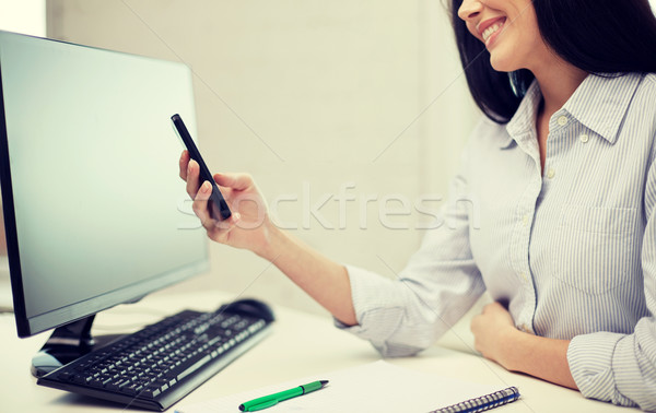 close up of woman texting on smartphone at office Stock photo © dolgachov