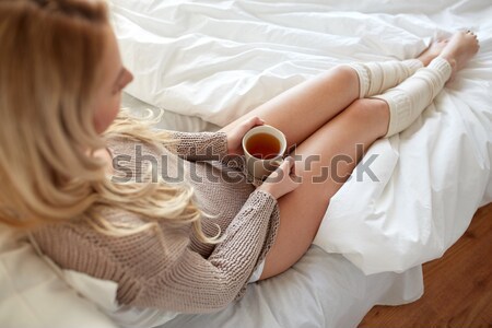 close up of woman with cocoa cup in bed at home Stock photo © dolgachov