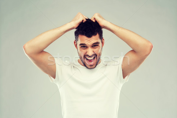 Crazy schreien Mann tshirt grau Emotionen Stock foto © dolgachov