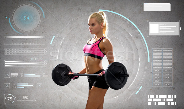 young sporty woman exercising with barbell Stock photo © dolgachov