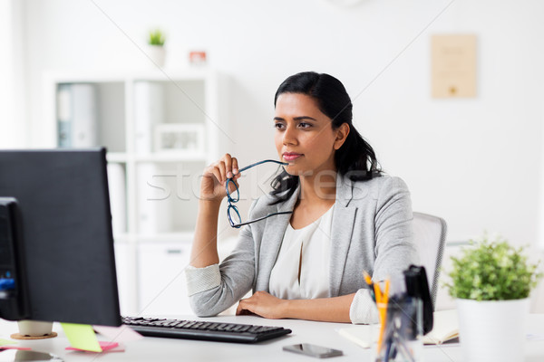 女性実業家 眼鏡 コンピュータ オフィス ビジネスの方々  作業 ストックフォト © dolgachov