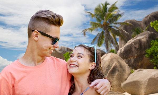 happy teenage couple hugging at summer beach Stock photo © dolgachov